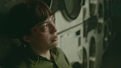 Pensive-Woman,-Brooding-Atmosphere-of-Lonely-Latina-in-Laundry-Room