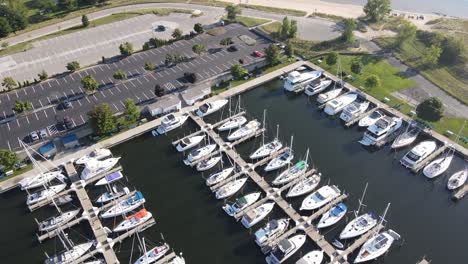 bird's eye pass over a marina in lush summer