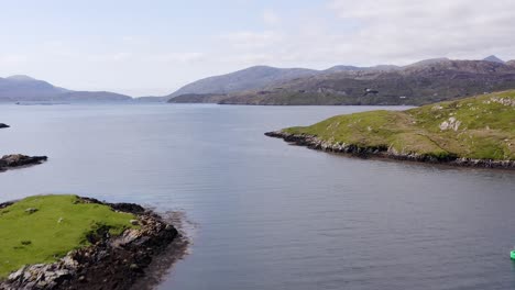 Drone-shot-of-the-bay-around-Tarbert,-a-village-on-the-Isle-of-Harris,-part-of-the-Outer-Hebrides-of-Scotland