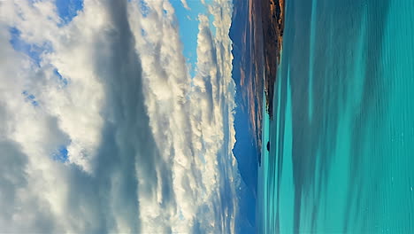 vertical orientation cloudscape timelapse over lake pukaki on road to mount cook, new zealand