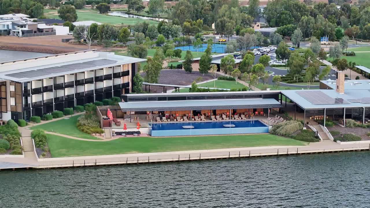 Close and low aerial view of swimming pool and outdoor dining area at the Sebel Hotel in Yarrawonga