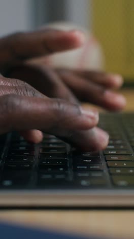 person typing on a laptop