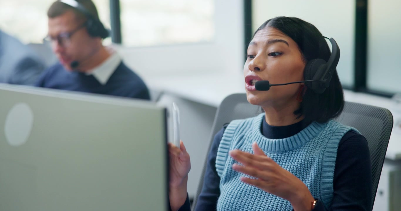 Customer Service Representative Talking on Headset in Office