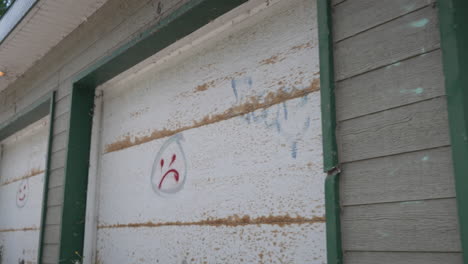 camera moving forward to reveal graffiti work on the wall of a garage