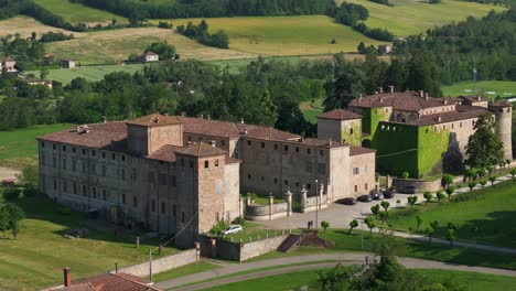 Aerial-backward-view-of-Agazzano-castle-in-Piacenza-province,-Italy