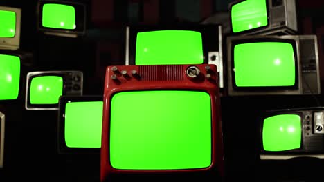 many vintage televisions turning on green screens. 4k resolution.