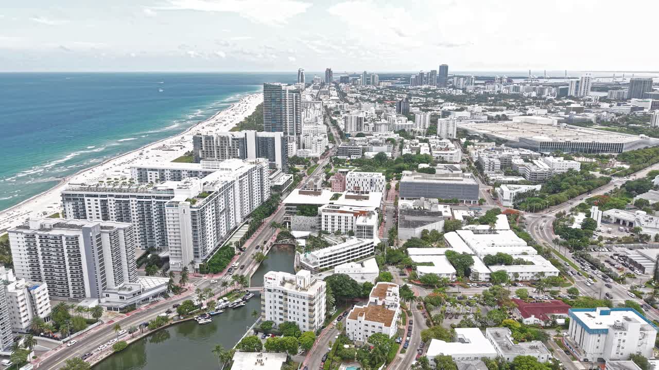 Aerial View of Miami Beach Cityscape, Beachfront Buildings, Street Traffic and Homes Along Indian Creek