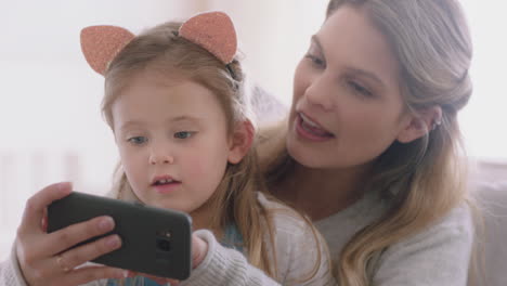 mother and child using smartphone having video chat little girl with mom waving sharing vacation weekend with daughter enjoying chatting on mobile phone 4k footage