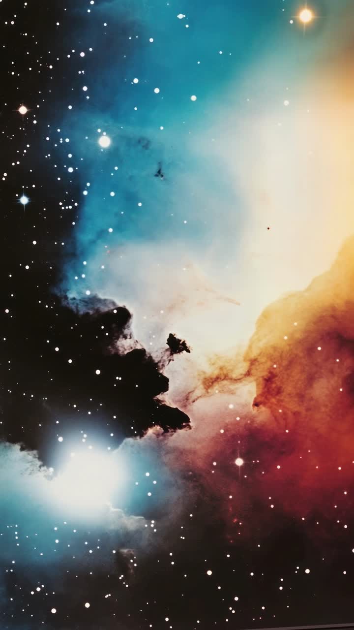 A mesmerizing video still of a nebula in deep space, captured from a wide-angle perspective