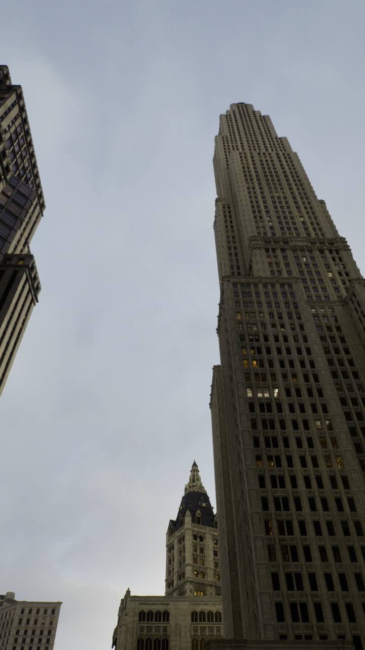 Skyscrapers reaching for the clouds in a bustling urban landscape during dusk