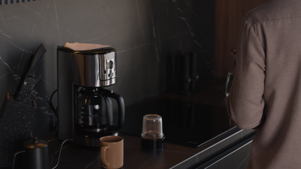Images of a man making coffee in a modern kitchen