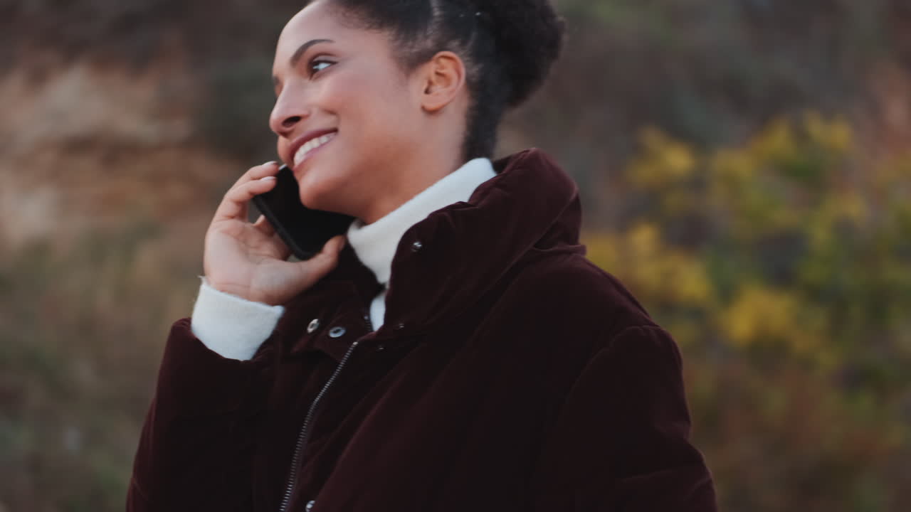 African American girl talking on mobile phone.