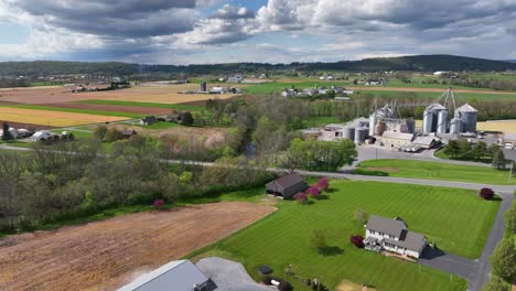 Aerial-establishing-shot-of-rural-area-in-american-town-with-farm-and-barn