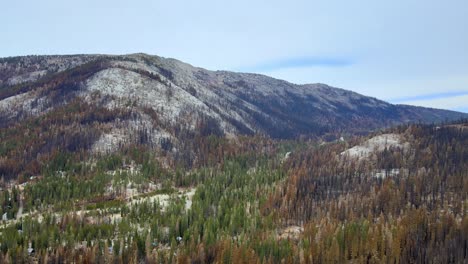 Aerial-view-over-forest-on-a-mountain-landscape-during-autumn-looking-at-Echo-summit,-California-Lake-Tahoe-area