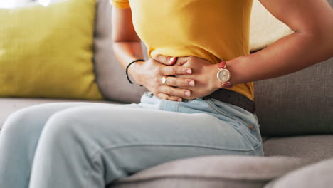 period, pain and hands of black woman on stomach