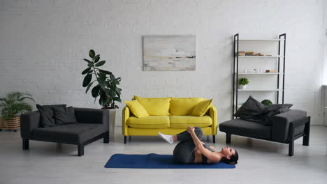 woman doing yoga exercises at home