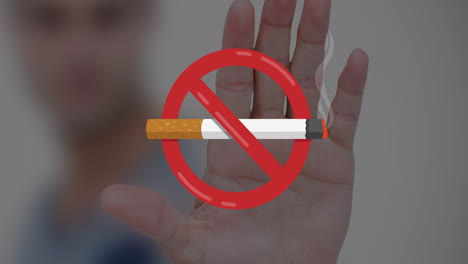 animation of no smoking sign with cigarette over caucasian man's hand