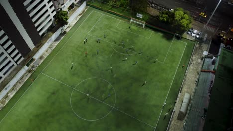 soccer players play a friendly match on a field next to the street