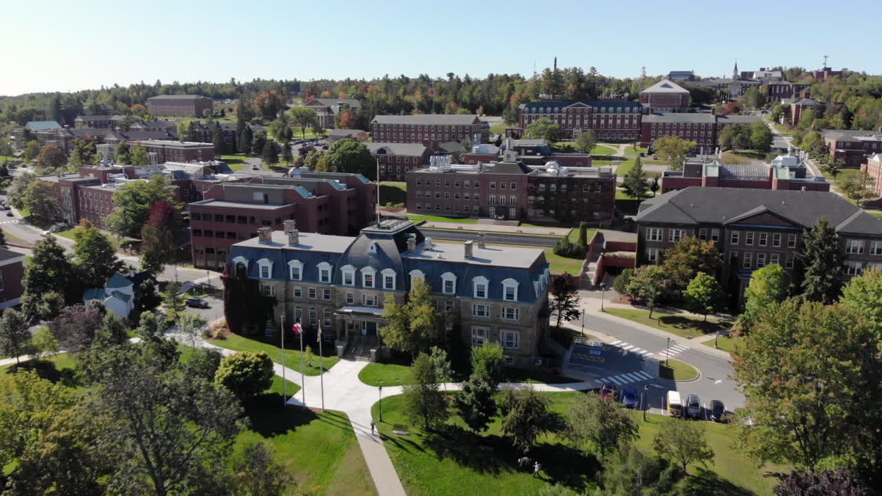 AERIAL: Tilting Up While Moving Forwards Toward Sir Howard Douglas Hall on the University of New Brunswick Fredericton Campus