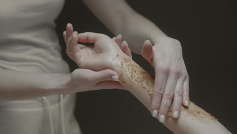 woman getting a sugar scrub treatment