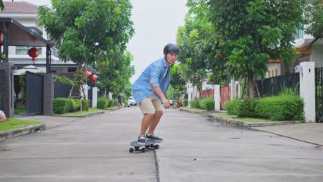 man skateboarding on a residential street