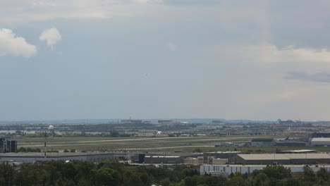 time lapse of toronto yyz pearson international airport with runway and city view in a cloudy weather