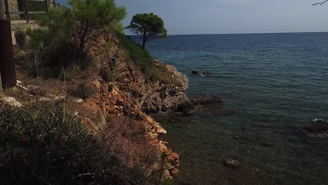 Little-beach-with-very-calm-waves-at-Cami-de-Ronda-from-Port-de-la-Selva-to-Llanç?