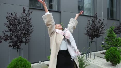 young woman throws up sheets of paper. crazy happy lady throwing documents