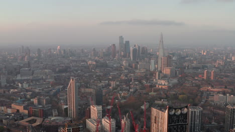 slow aerial shot over elephant and castle towards the city of london