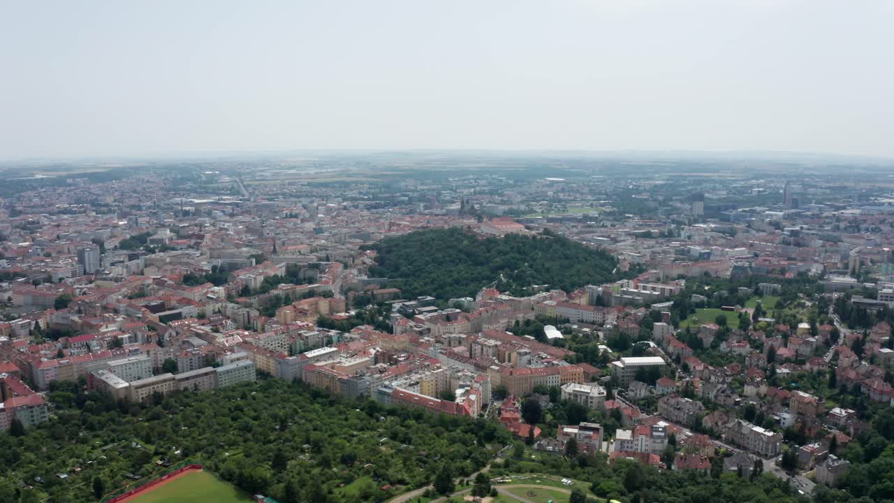 wide side drone shot of castle in brno city