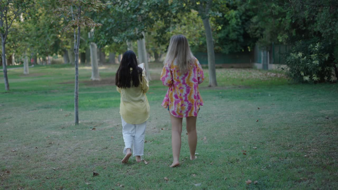 Two Women Reading in a Park