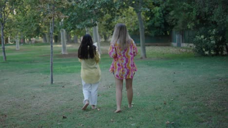 two women reading in a park