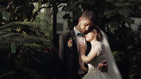 newlyweds. caucasian groom with bride in the park. wedding couple. happy family
