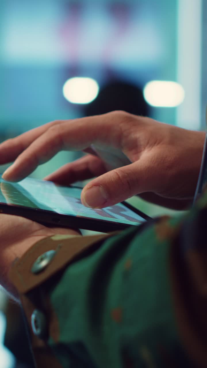 Close-up of Soldier's Hand Interacting with Digital Mobile Device