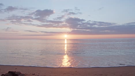 bright sunset reflects in mediterranean sea water near cyprus island coastline, static cinematic view