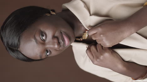 portrait of a woman in a beige blazer