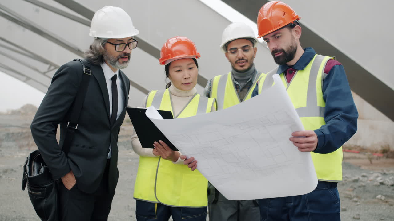 Construction Team Reviewing Blueprint