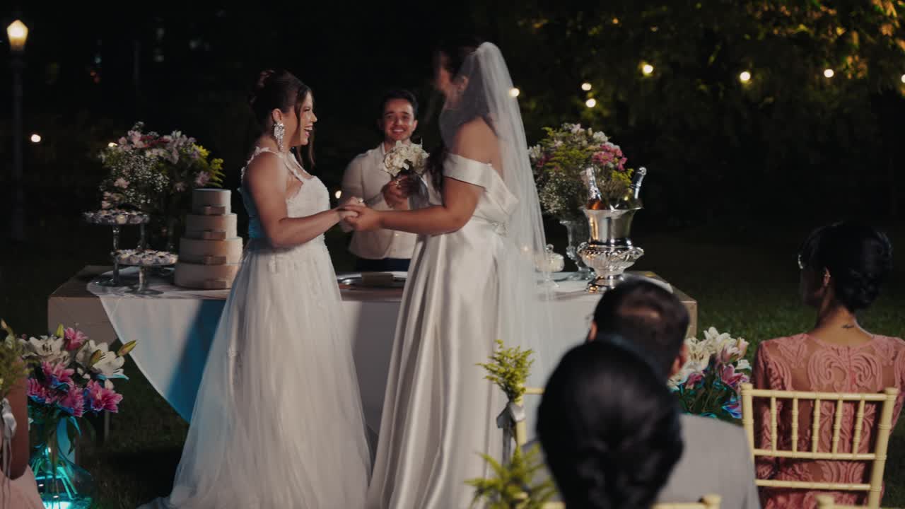 Joyful Outdoor Wedding Ceremony of Two Brides at Night