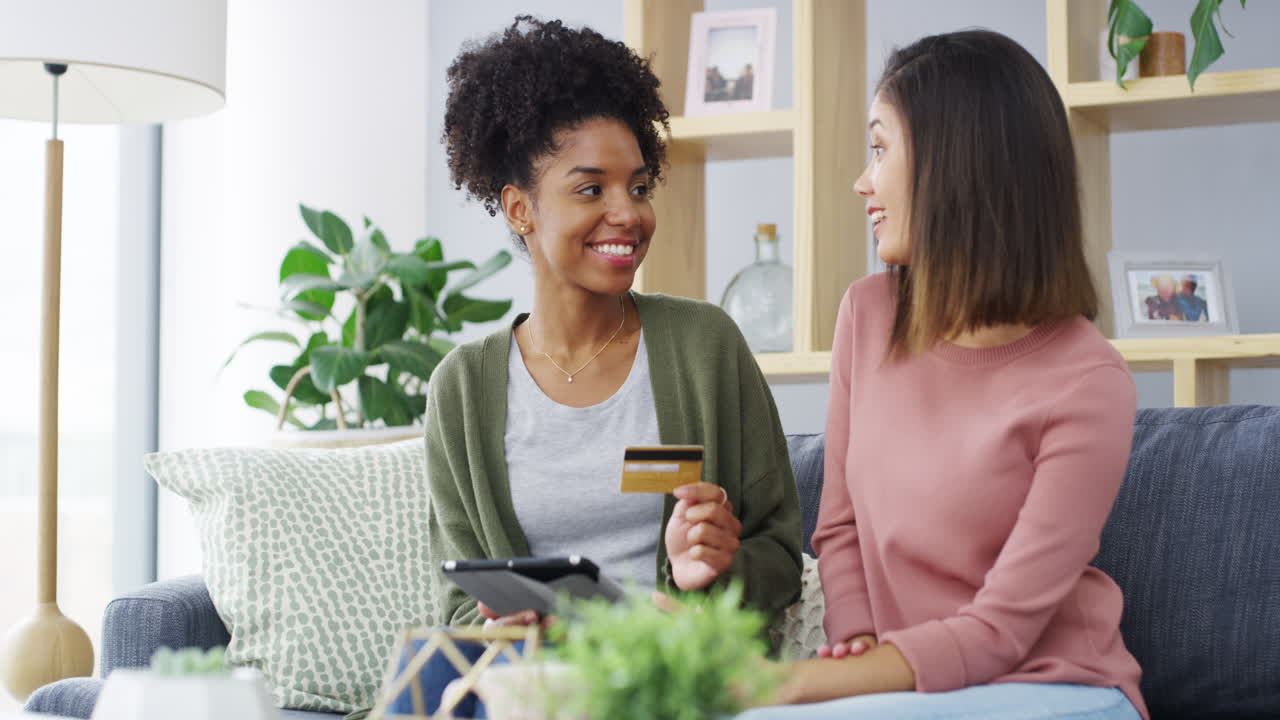 two young women using a digital tablet
