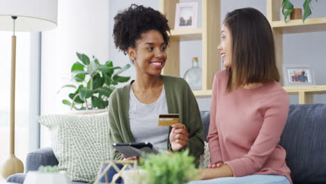 two young women using a digital tablet