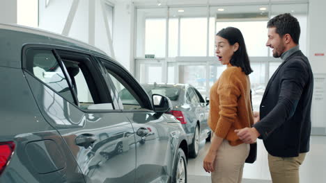 happy couple buying a car