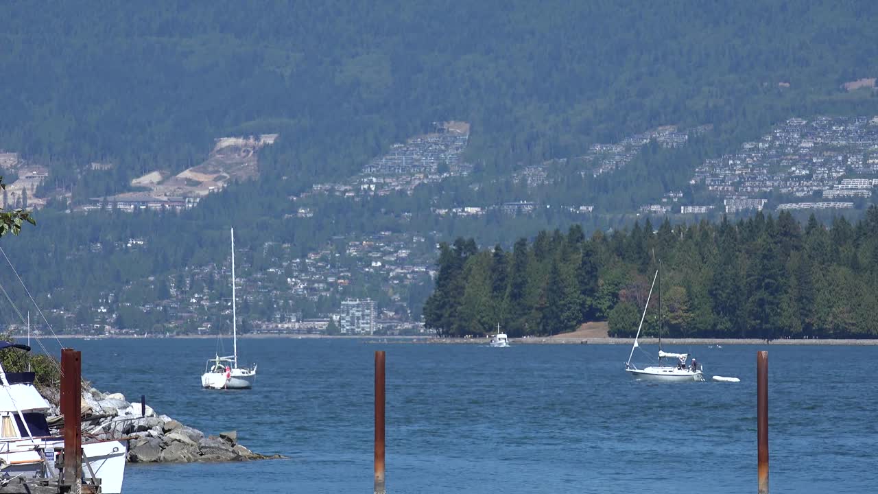 Vancouver ocean views and boats. See boats and the Pacific Ocean withviews of the shoreline and mountains