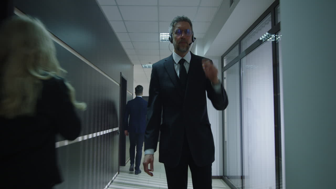 Businessman in Office Corridor