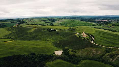 Establishing-aerial-view-of-Italy's-vast-countryside-filled-with-lush-farmland