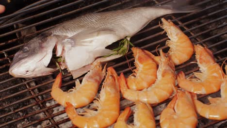 grilled fish and shrimp on a barbecue