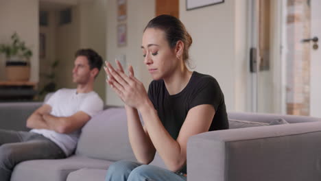 couple, fight and conflict of divorce on sofa