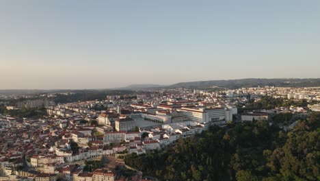 establishing aerial circling view of coimbra in portugal with mondego river in background