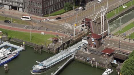 cargo ship exiting canal sluice gate