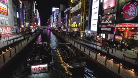 tourist boat cruising down a lively canal