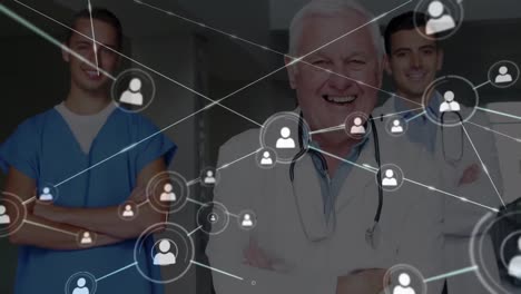 Animation-of-network-of-connections-with-icons-over-diverse-doctors